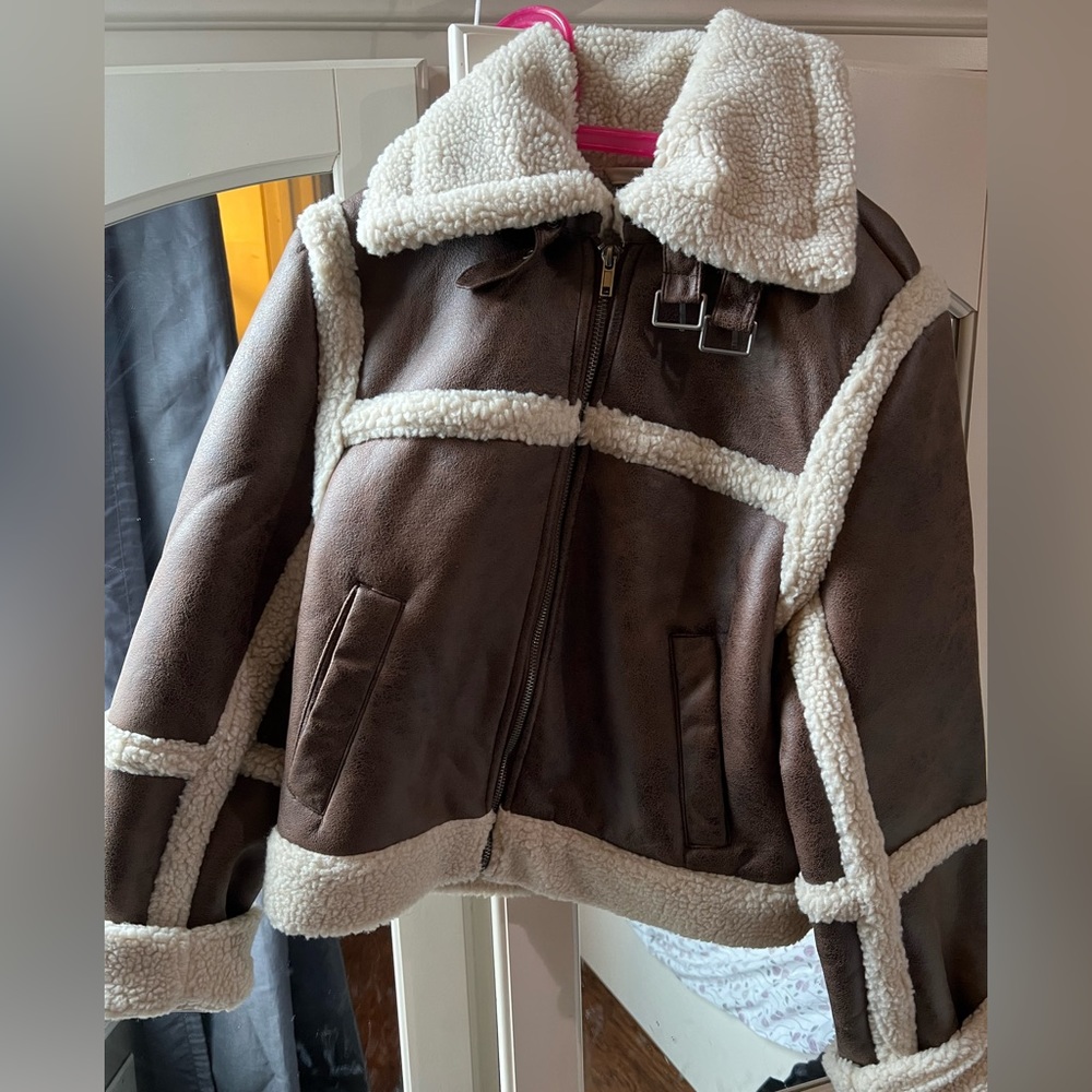 Faux leather aviator jacket lined with wool and buckles